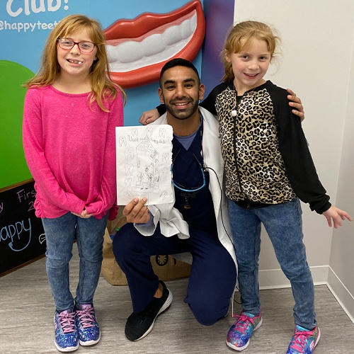 Doctor Singh and two young dental patients