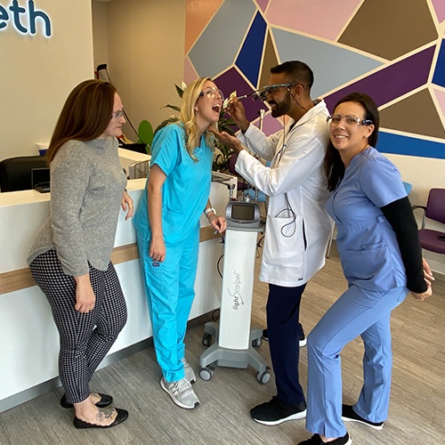 Doctor Singh and three Happy Teeth Pediatric Dentistry and Orthodontics dental team members having fun in dental office