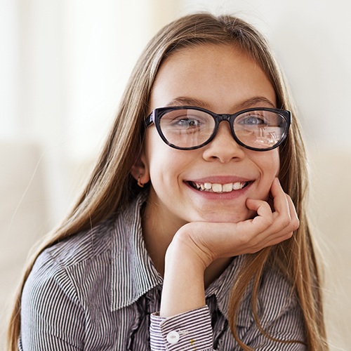 Little girl sharing flawless smile after metal free dental restoration