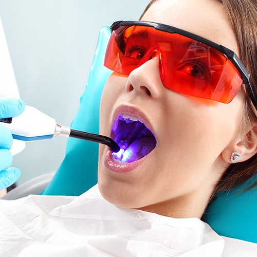 Young woman receiving dental bonding treatment