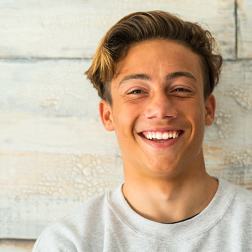 Male teenager smiling after treatment 