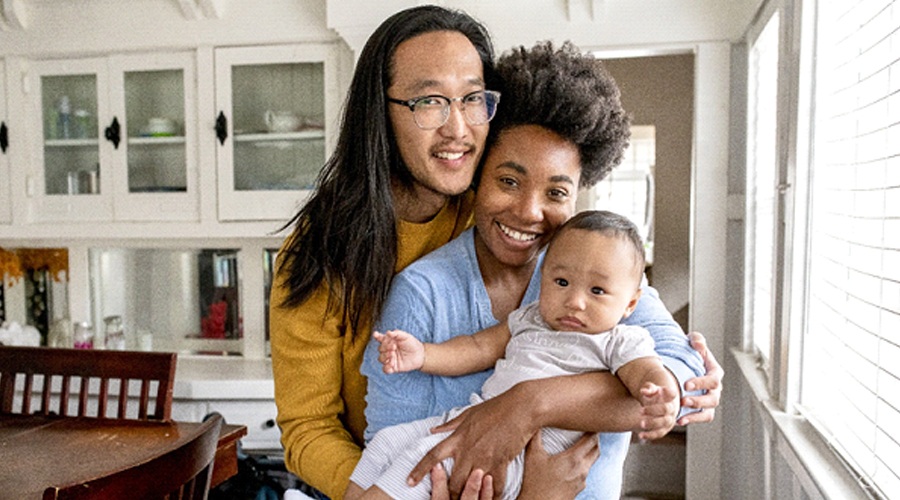 A mother, father, and baby smiling after having their little one’s tongue tie in Levittown revised