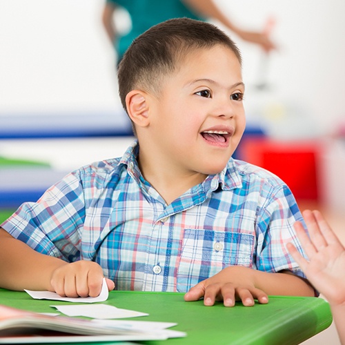 Laughing boy in classroom