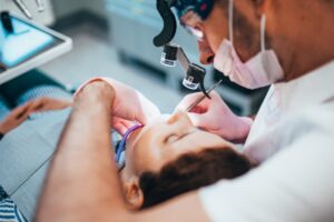 Dentist performing pulp therapy.